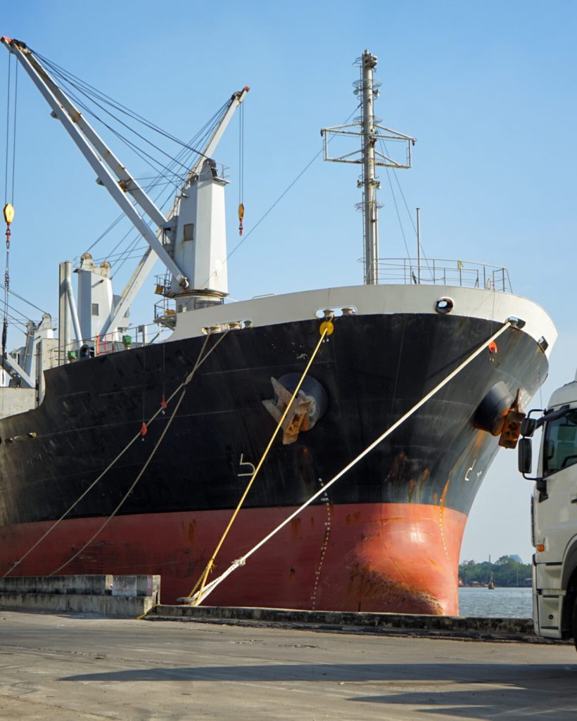 Commercial Ship or vessel at international harbor for logistics transportation